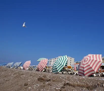 Parasols on the beach Stock Photos