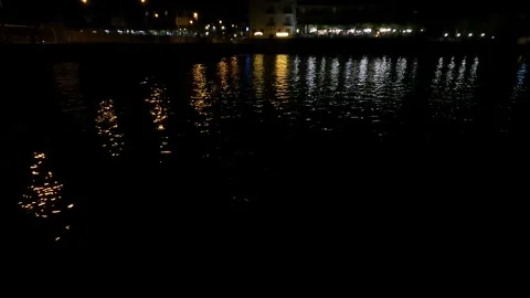 Paratico's lights are reflected in the Oglio River Video stock 245948046