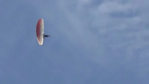 The paratrike flies right above the camera and changes its flight angle Video stock 309367158