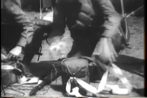 Paratrooper of the Carrier Command removes equipments from bag - 1944-1945 Stock Footage 112173638