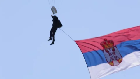 A paratrooper with a Serbian flag Stock Footage 288207755