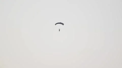 A Paratrooper showcase skill during a UAE military demonstration 스톡 동영상 347403599