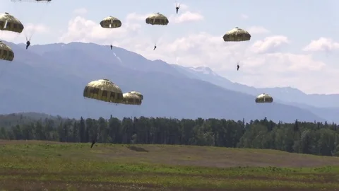 Paratroopers jump from Lockheed C-130 Hercules onto the Malemute Drop Zone- 2018 Stock Footage 97640694