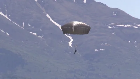 Paratroopers jump from Lockheed C-130 Hercules onto the Malemute Drop Zone- 2018 Stock Footage 97640711