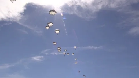 Paratroopers jump from Lockheed C-130 Hercules onto the Malemute Drop Zone- 2018 Stock Footage 97640720