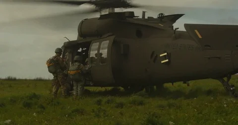 Paratroopers loading Helicopter Video stock 84075603