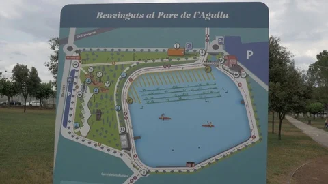 Parc Agulla sign cartel map welome entrance warning info park pond Stock Footage 113458373