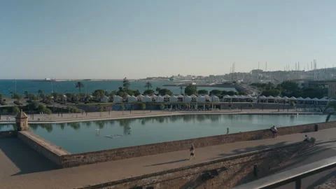 Parc de la Mar lake and historic walls with sentry box in Palma de Mallorca 動画素材 339767146