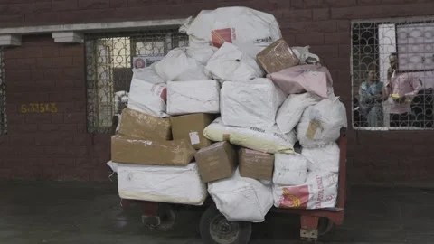 Parcel begs received of Railway Parcel Services at station Stock Footage 285298672