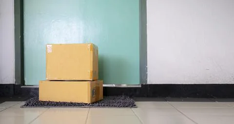 A parcel box placed at the front of the door. Quarantine, contactless deliver Foto stock