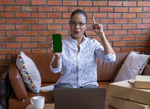 Parcel Box stack for Selling.Delivery Mail Shipping Woman Seller checking the Stock Photos