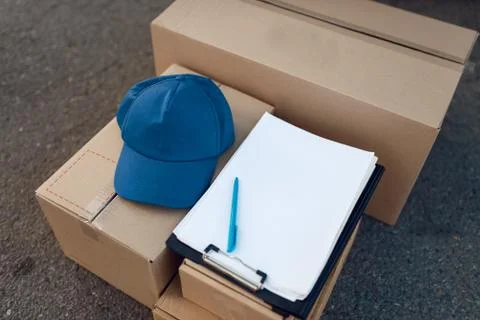 Parcel boxes and cap, delivery service concept 写真素材