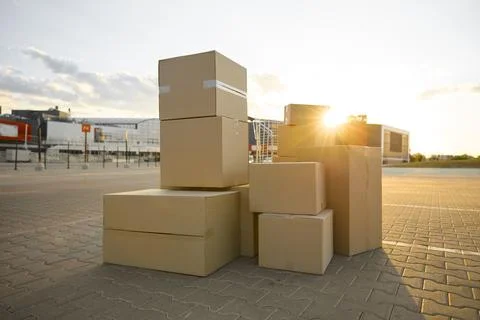 Parcel boxes stack on street city waiting for house moving service Foto stock