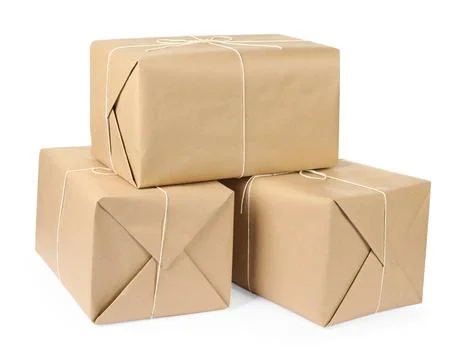 Parcel boxes wrapped in paper isolated on white Stock Photos