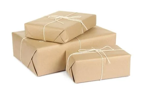 Parcel boxes wrapped in paper isolated on white Stock Photos