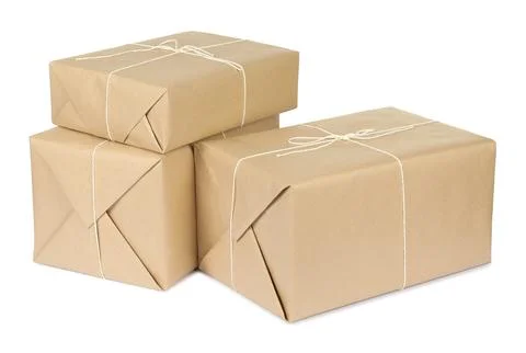 Parcel boxes wrapped in paper isolated on white Stock Photos