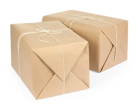 Parcel boxes wrapped in paper isolated on white Stock Photos
