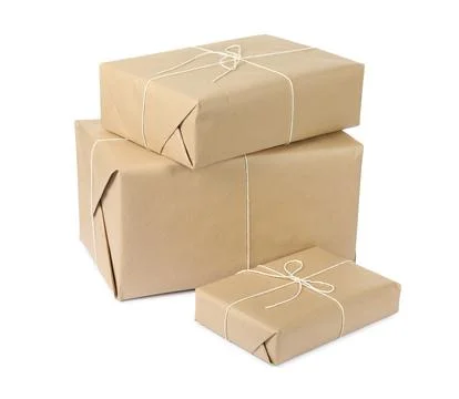 Parcel boxes wrapped in paper isolated on white Stock Photos