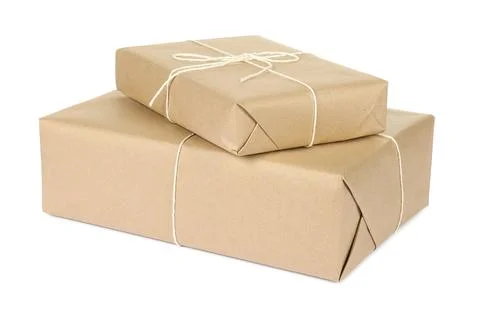 Parcel boxes wrapped in paper isolated on white Stock Photos