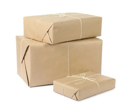 Parcel boxes wrapped in paper isolated on white Stock Photos