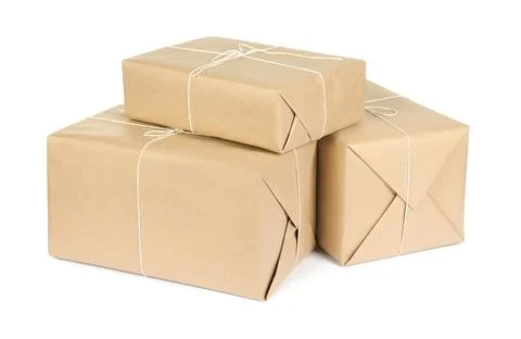 Parcel boxes wrapped in paper isolated on white Stock Photos