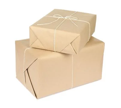 Parcel boxes wrapped in paper isolated on white Stock Photos