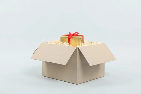 Parcel with gift box on light background 스톡 사진