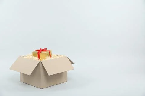 Parcel with gift box on light background 스톡 사진