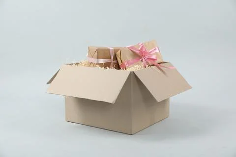 Parcel with gift boxes on light background Foto stock