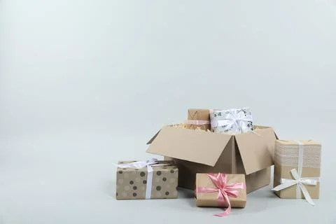 Parcel with gift boxes on light background Foto stock