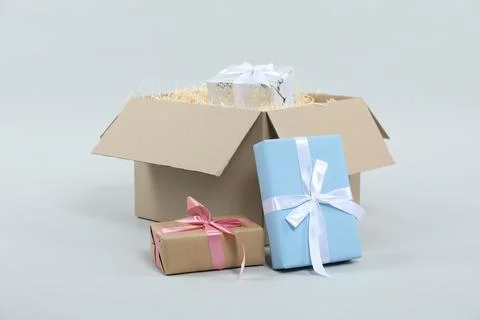 Parcel with gift boxes on light background Foto stock