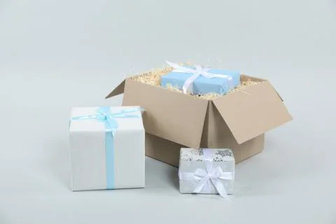 Parcel with gift boxes on light background 스톡 사진