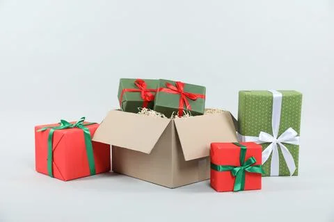Parcel with gift boxes on light background Foto stock