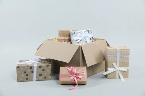 Parcel with gift boxes on light background Foto stock