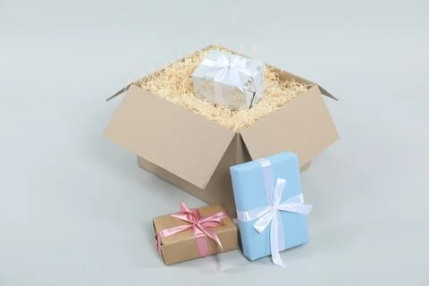 Parcel with gift boxes on light background Foto stock