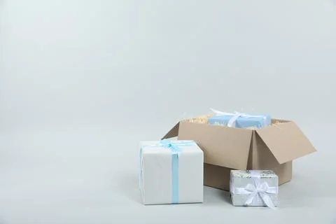 Parcel with gift boxes on light background 스톡 사진