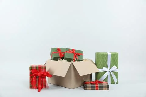 Parcel with gift boxes on light background Foto stock