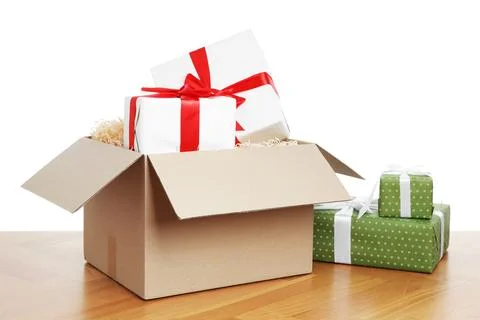 Parcel with gift boxes on wooden table against white background 스톡 사진