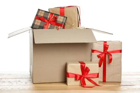 Parcel with gift boxes on wooden table against white background 스톡 사진