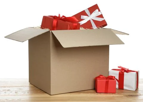 Parcel with gift boxes on wooden table against white background 스톡 사진