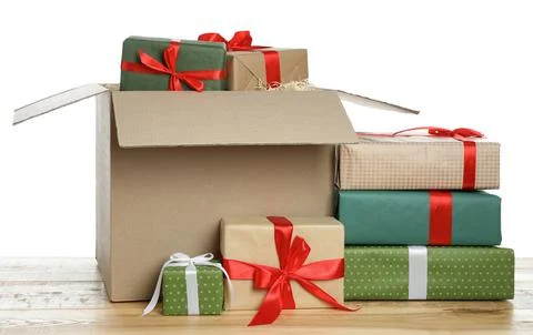 Parcel with gift boxes on wooden table against white background Foto stock