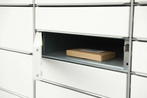 Parcel in locker of automated postal box Stockfoto's
