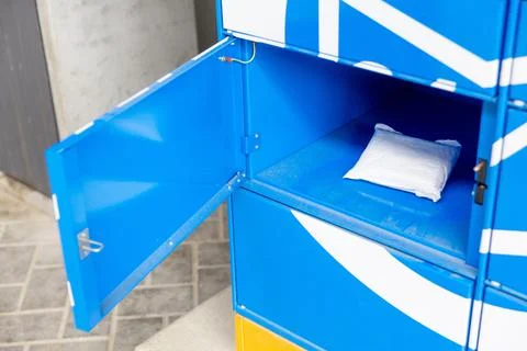 Parcel in locker of automated postal box. 스톡 사진