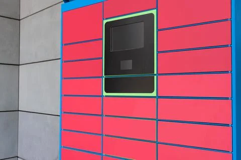 Parcel locker with many postal boxes near building outdoors Stock Photos