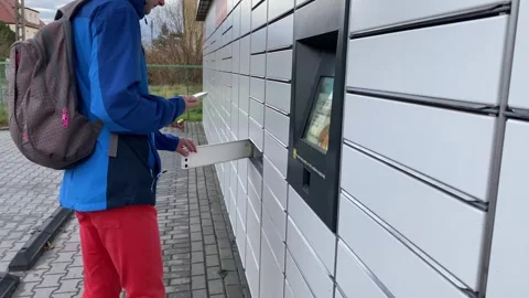 Parcel locker simplifies delivery and pickup. Automated terminals make parcel Stock Footage 292875640