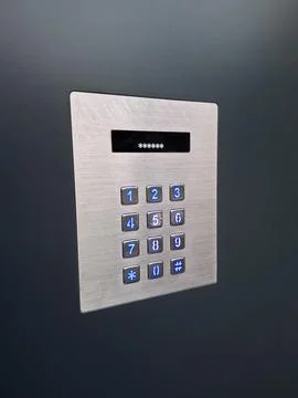 The parcel machine features a stainless PIN pad with a screen and keyboard Stock Photos