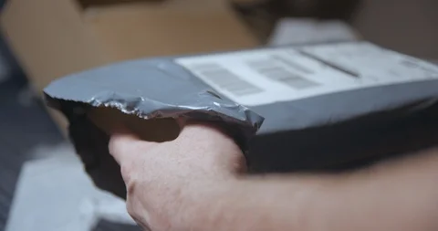 Parcel opening with tablet inside Видео 100491756