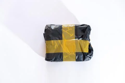 Parcel package on white background. Shipping package from China Photos
