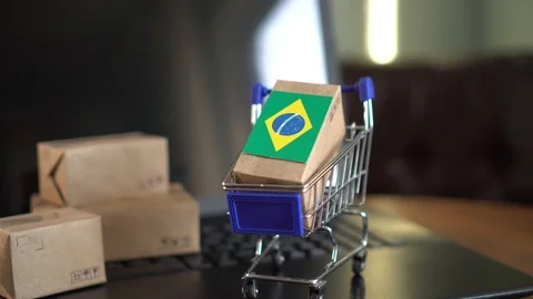 Parcel packaging box with a flag of Brazil in a shopping cart 動画素材 102363449