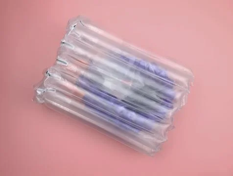 Parcel packed in air protective packaging. Stock Photos